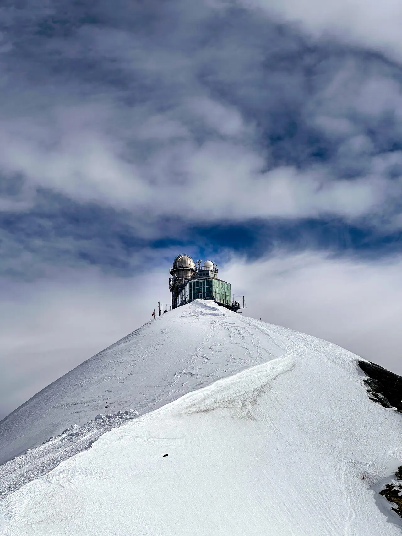 The Sphinx observatory isolated on a snowy ridge