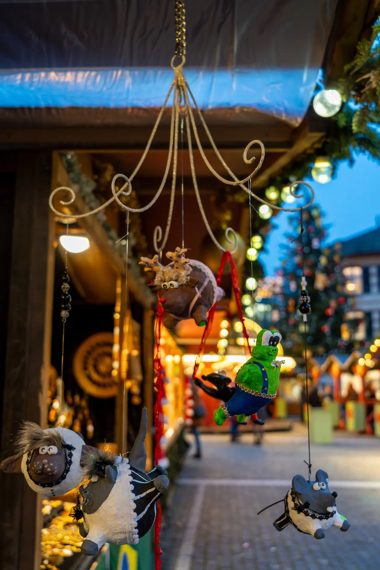 A glass ornament reflecting the Christmas market